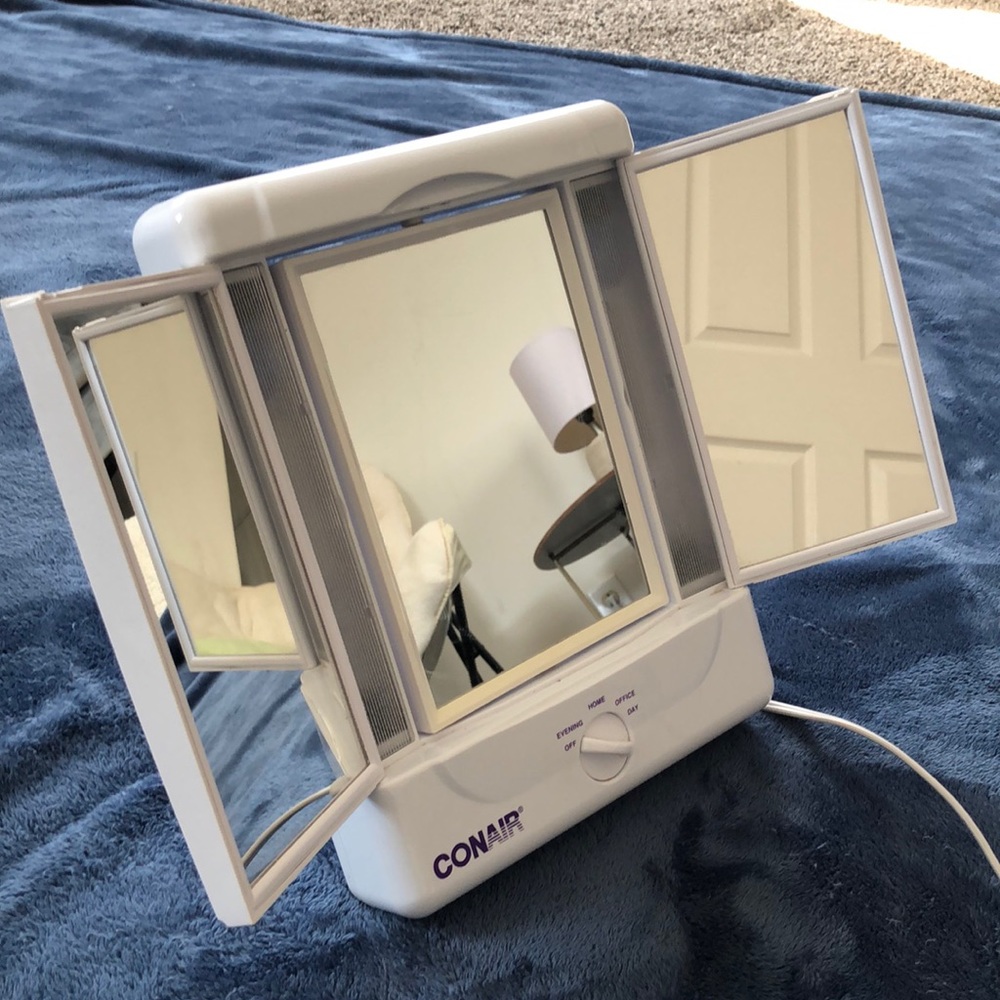 Two-sided lighted makeup mirror